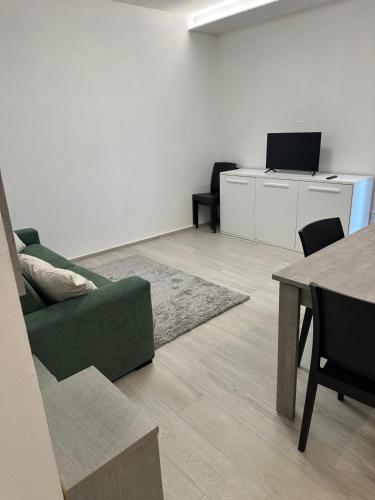 Телевизор и/или развлекательный центр в Appartamento Cataleya