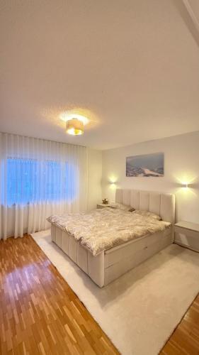 Кровать или кровати в номере Ferienwohnung RheinZeit