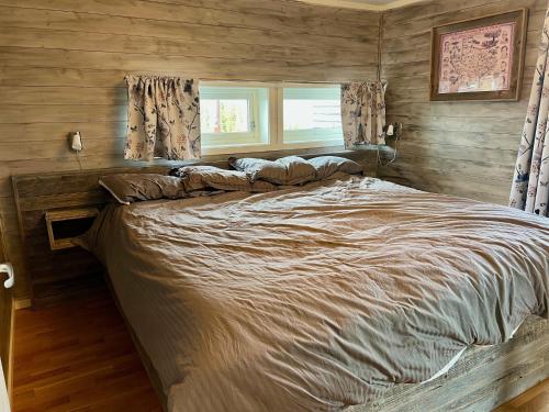 En eller flere senge i et værelse på TexasToppen, cabin in Hafjell with sauna