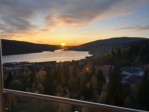 a view of a river with the sunset in the background at Tott vacation homes in Åre