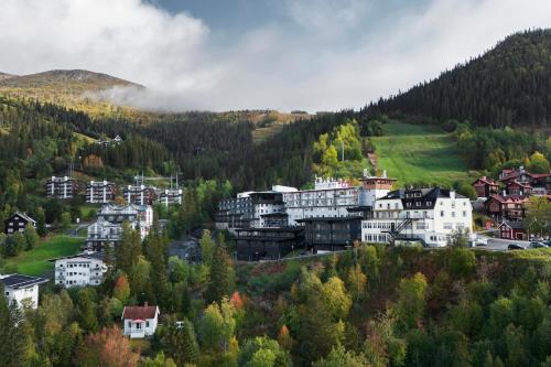a town on a hill with houses and trees at Tott vacation homes in Åre