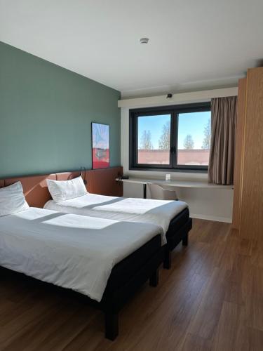 Postel nebo postele na pokoji v ubytování Ibis Roma Fiera