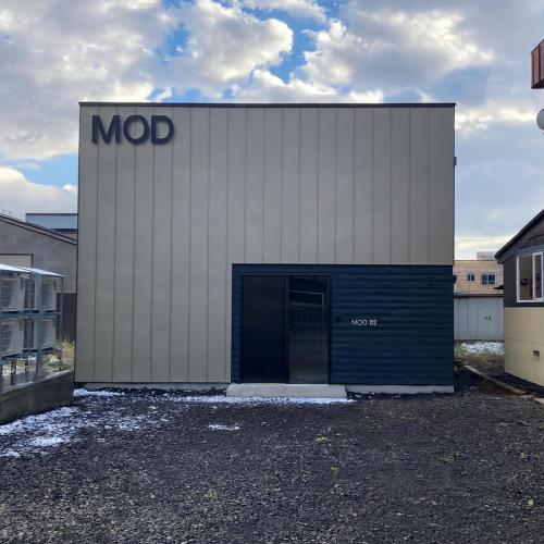 a building with a mooc sign on the side of it at MOD 02 Kutchan Stylish Commons - NO PARKING 駐車場なし in Kutchan