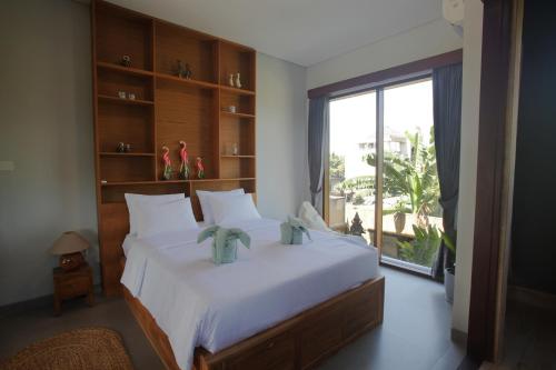 Ένα ή περισσότερα κρεβάτια σε δωμάτιο στο Indira villa