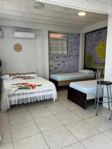 Ένα ή περισσότερα κρεβάτια σε δωμάτιο στο Pousada Cantinho Azul