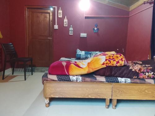 En eller flere senge i et værelse på Apple garden cafe and stay