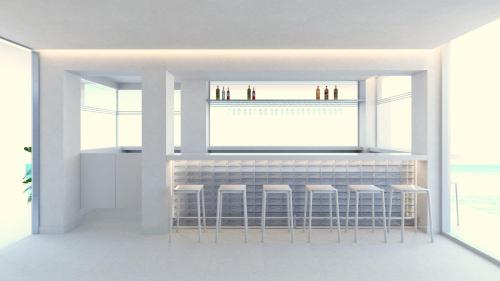 Postel nebo postele na pokoji v ubytování Kos Aktis Art Hotel