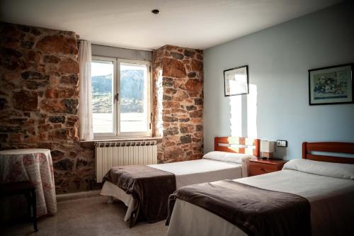 Ένα ή περισσότερα κρεβάτια σε δωμάτιο στο Biltegi Etxea