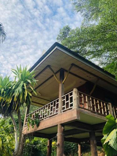 a house with a balcony on top of it at Pizza classic resort kohjum in Ban Ko Phrao