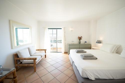 Postel nebo postele na pokoji v ubytování Cabana da Ria