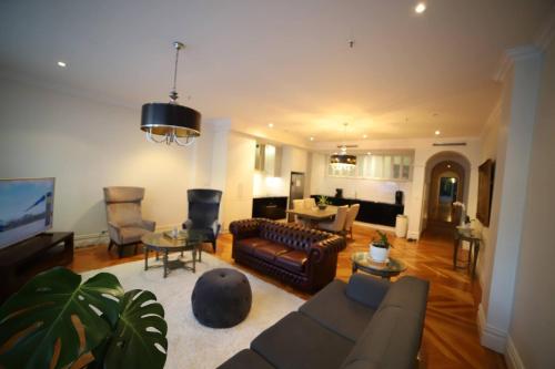 a living room with a couch and a table at King Street Retreat in Perth