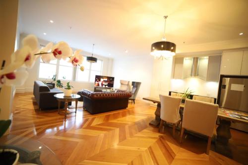 a living room with a couch and a table at King Street Retreat in Perth