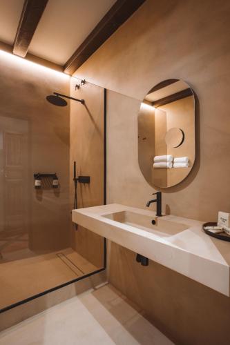 a bathroom with a sink and a shower at Hotel Boutique Villa Emilia in Playa