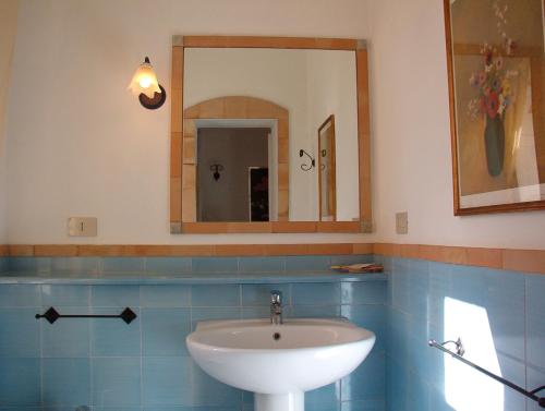 a bathroom with a sink and a mirror at Casa PAGLIERA in Porto San Giorgio