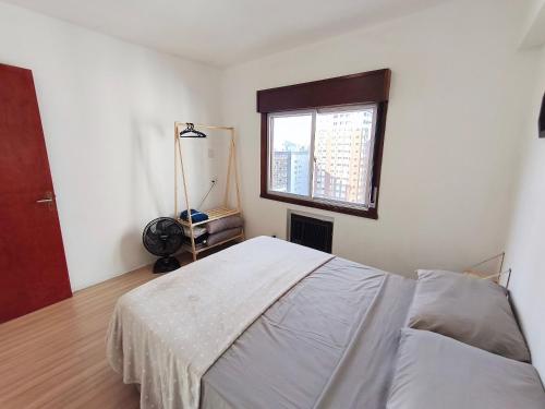 Ένα ή περισσότερα κρεβάτια σε δωμάτιο στο Cobertura duplex c/ terraço e churrasqueira em BC