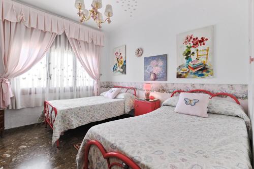 a bedroom with two beds and a window at Villa en Lorca 2 Piscinas Vistas Gran Terraza y Barbacoa-Venta Ruizo Hasta 20 personas in Lorca