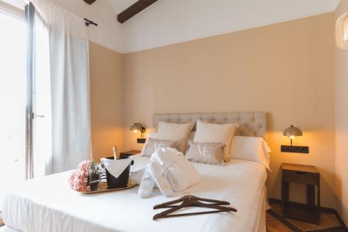 En eller flere senge i et værelse på Hotel Boutique Villa Emilia