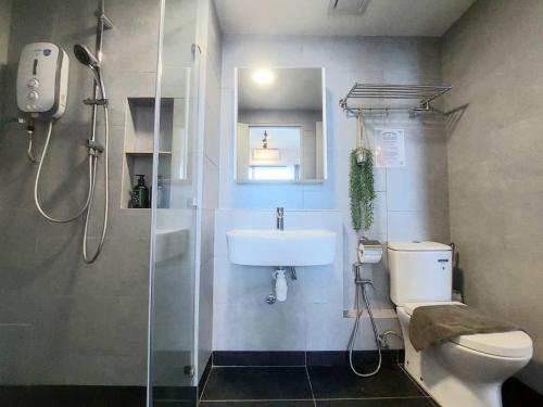 a bathroom with a toilet and a sink and a shower at J'Stay Seaview Suite Jesselton Quay Kota Kinabalu in Kota Kinabalu