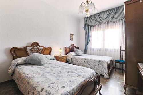 Postel nebo postele na pokoji v ubytování Villa Venta Ruizo Terraza Enorme con Piscina Barbacoa y Vistas Espectaculares- ideal para familias