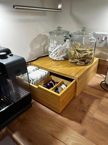 a drawer in a kitchen with two glass jars at Olive Tree House in Edwinstowe