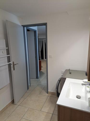 a bathroom with a sink and a mirror at le Cocon in Montgardin