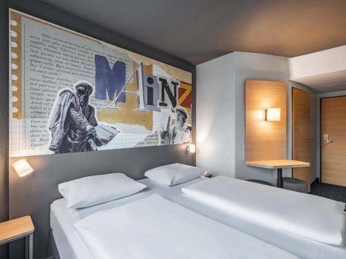 Postel nebo postele na pokoji v ubytování B&B HOTEL Mainz-Süd