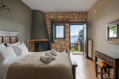 Postel nebo postele na pokoji v ubytování Ξενώνας Θεαλίς