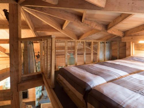 Postel nebo postele na pokoji v ubytování Boomhut XXL