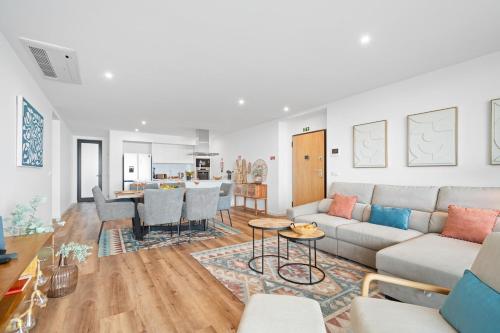 a living room with a couch and a table at Peace Haven III in Câmara de Lobos