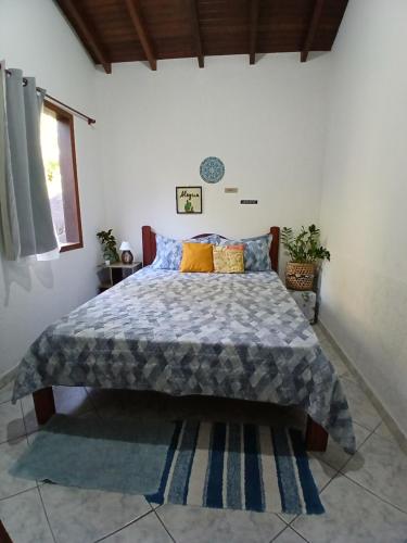 En eller flere senge i et værelse på Entre Árvores Hoosts Confort