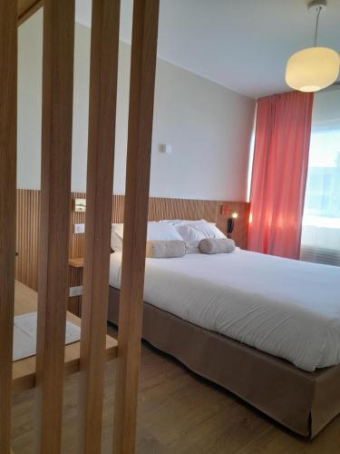 Ένα ή περισσότερα κρεβάτια σε δωμάτιο στο Hôtel Albion