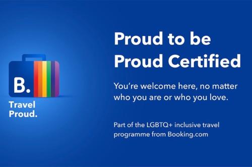 a sign that says proud certified with a suitcase at Tres Corazones in Carrillo