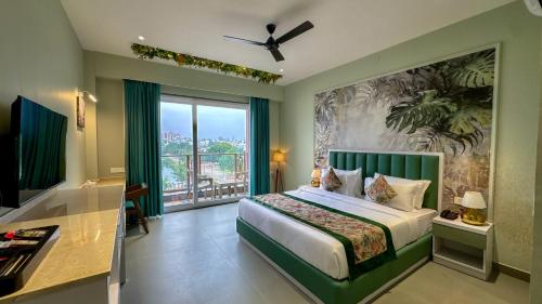 a bedroom with a bed and a large window at Lakeside Leisure A Lake View Hotel in Udaipur