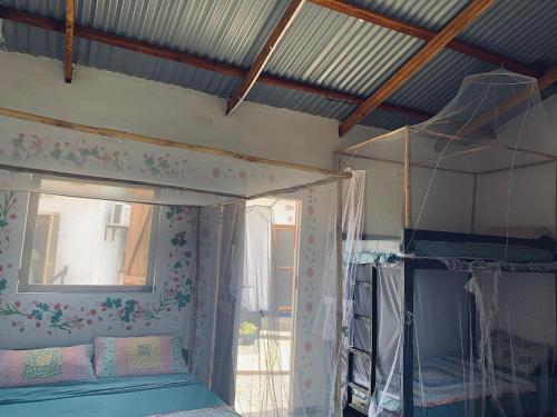 Postel nebo postele na pokoji v ubytování Chipatso