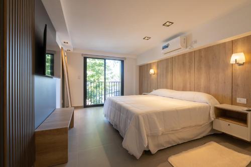 En eller flere senge i et værelse på Bertolino Hotel