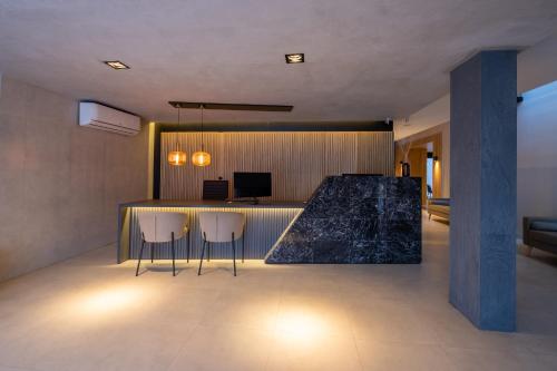 TV a/nebo společenská místnost v ubytování Bertolino Hotel