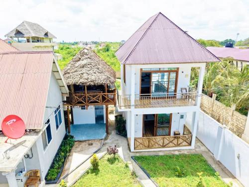 an aerial view of a house with a roof at Swahili lodge nungwi in Kinyasini