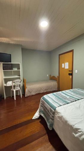Ένα ή περισσότερα κρεβάτια σε δωμάτιο στο Hotel Pousada do Mel