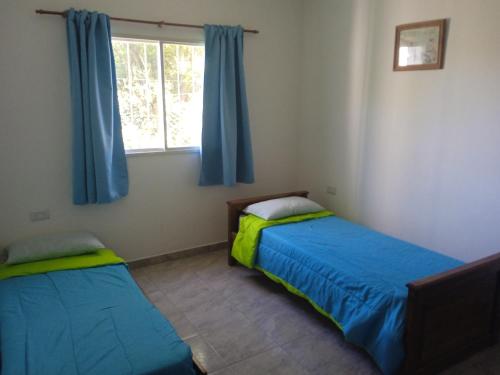 En eller flere senge i et værelse på Piquillin San Lorenzo