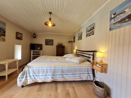 Ένα ή περισσότερα κρεβάτια σε δωμάτιο στο Au fil du temps 54