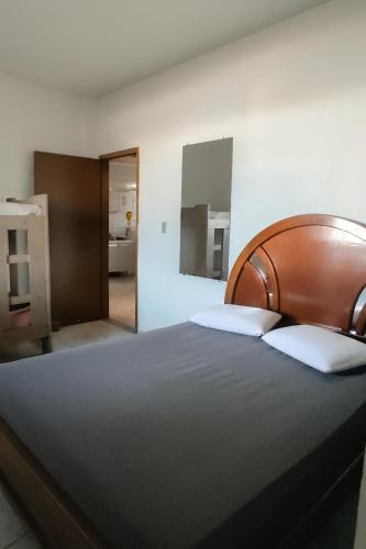 Ένα ή περισσότερα κρεβάτια σε δωμάτιο στο Jacaraipe ES -Lar de Praia casa temporada