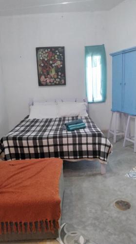 Ένα ή περισσότερα κρεβάτια σε δωμάτιο στο Casa Compartilhada - Shared house