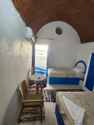 Postel nebo postele na pokoji v ubytování Endo Mando