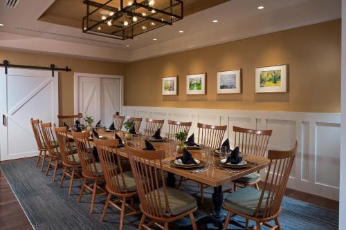 a conference room with a long table and chairs at The Inn At Swarthmore in Swarthmore