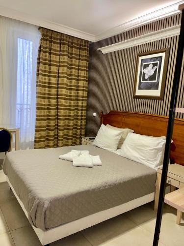 Giường trong phòng chung tại STYLE HOTEL