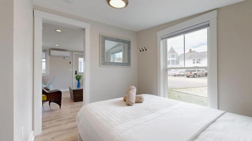 En eller flere senge i et værelse på Nautical View