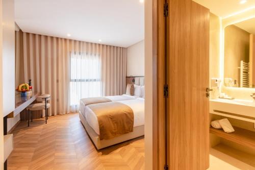 Ένα ή περισσότερα κρεβάτια σε δωμάτιο στο Citadines Almaz Aparthotel Casablanca