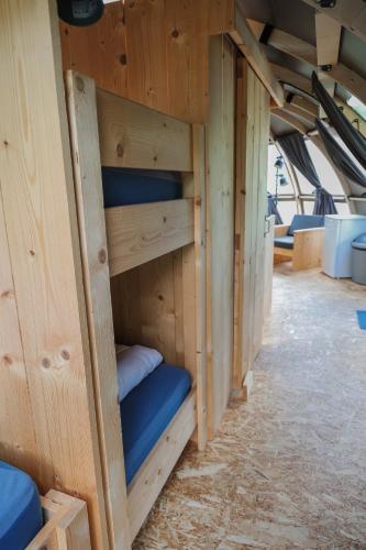 a row of bunk beds in a room at Panorama in Hoogersmilde