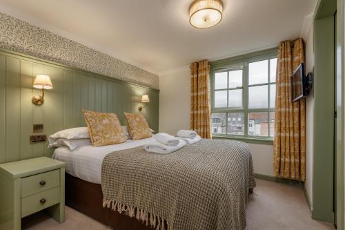 Postel nebo postele na pokoji v ubytování The Albany St Andrews