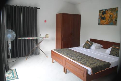 Giường trong phòng chung tại Babylon Appartment Hanthana